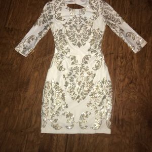 A white and gold short formal dress